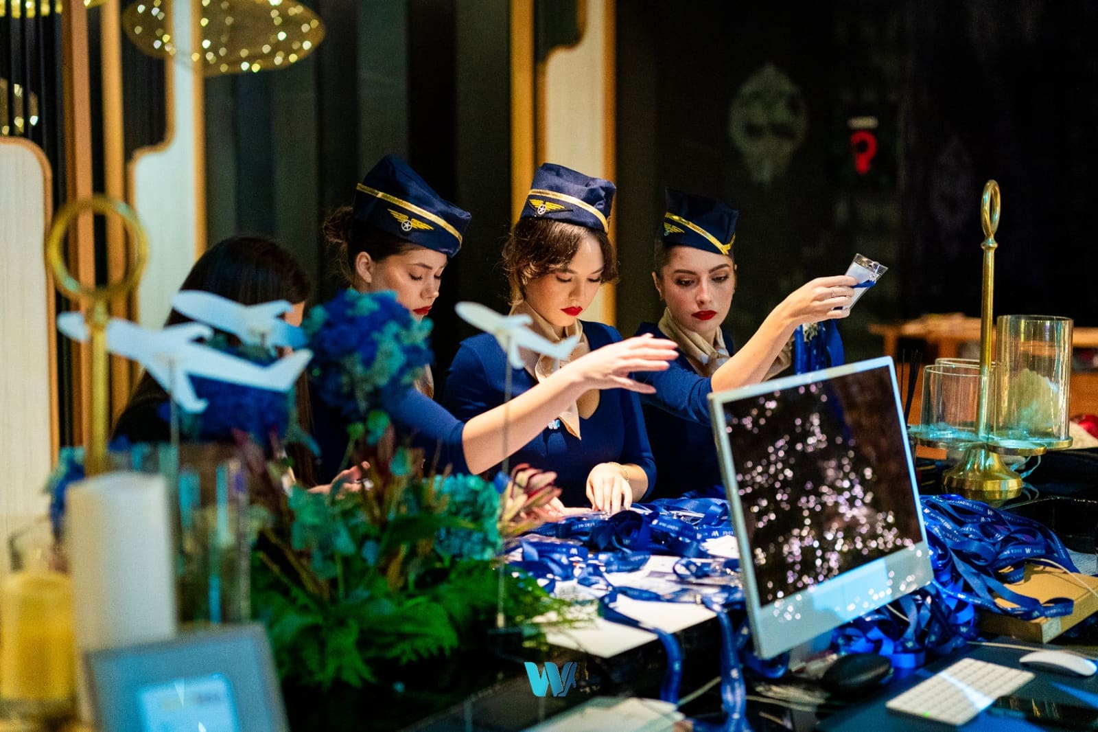 WingX check-in crew at the welcome desk